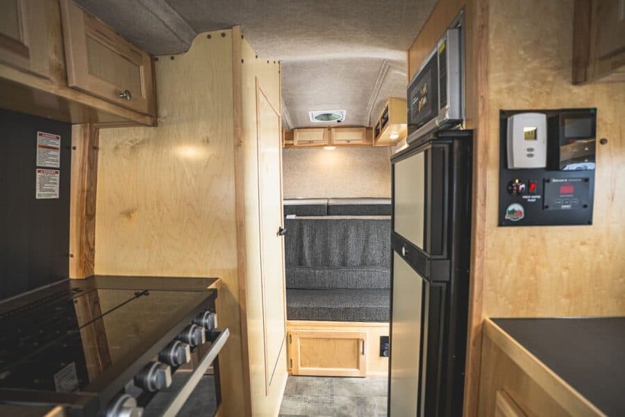 Stove, refrigerator, and control panel looking forward