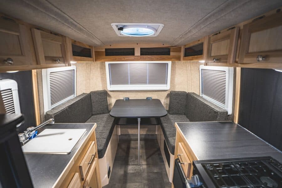 Rear dinette with a table and three windows