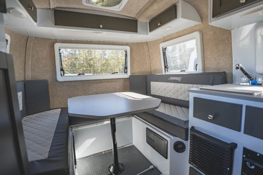 U-shaped rear dinette with grey quilted cushions