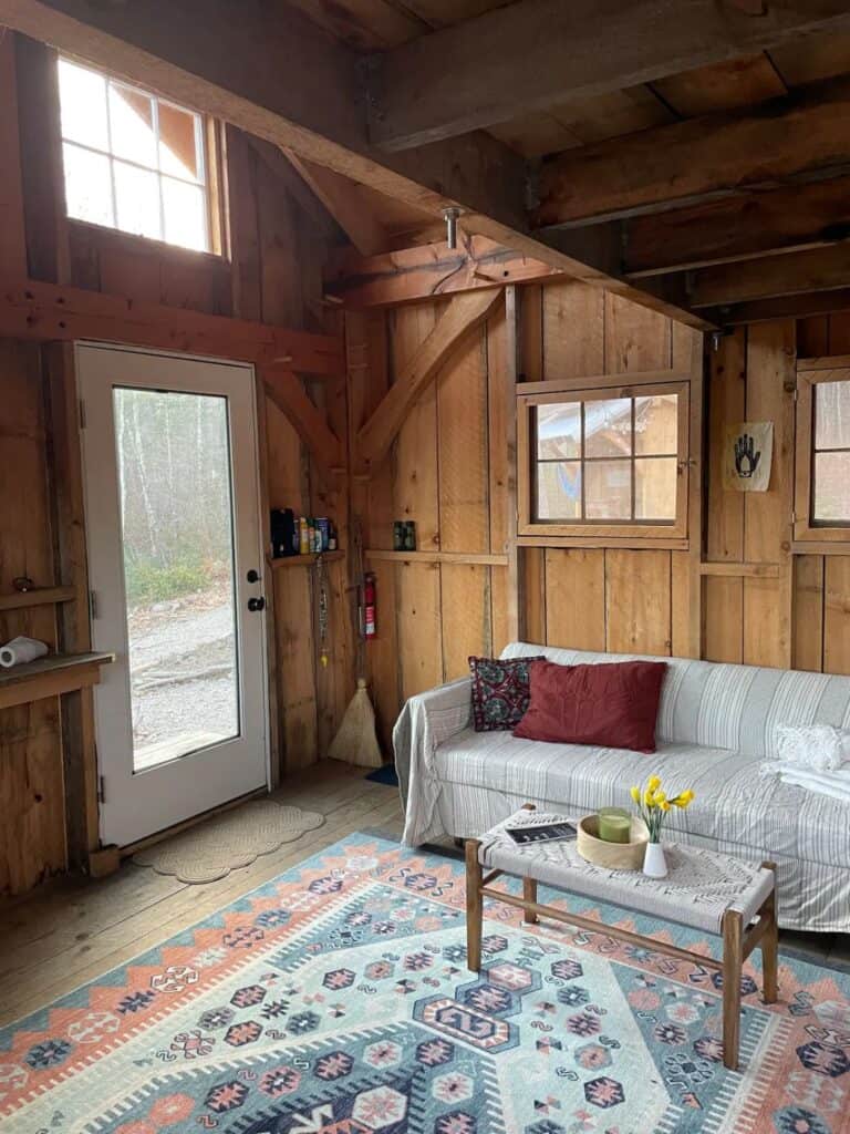 Image showcasing Semi-Off-Grid Cabin in Massachusetts with Board & Batten Siding