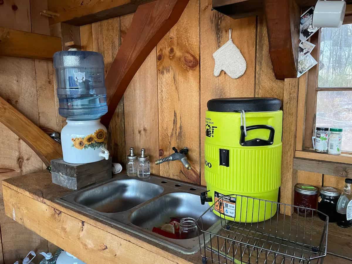 Image showcasing Semi-Off-Grid Cabin in Massachusetts with Board & Batten Siding