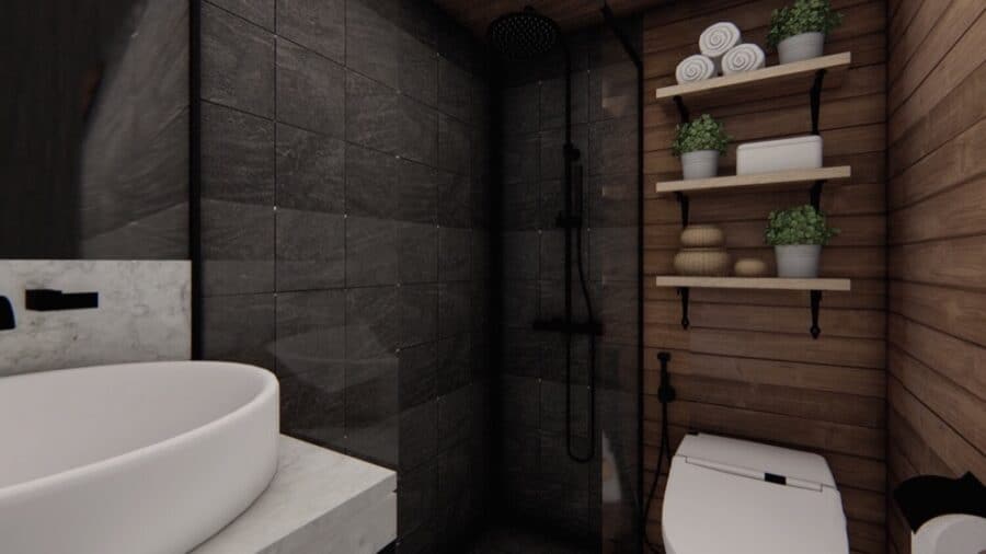 Modern tiny house bathroom with dark tiles and wooden accents, compact and stylish.
