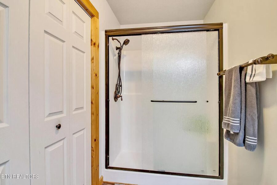 Small bathroom with shower in a tiny house on 12 acres in Tennessee.