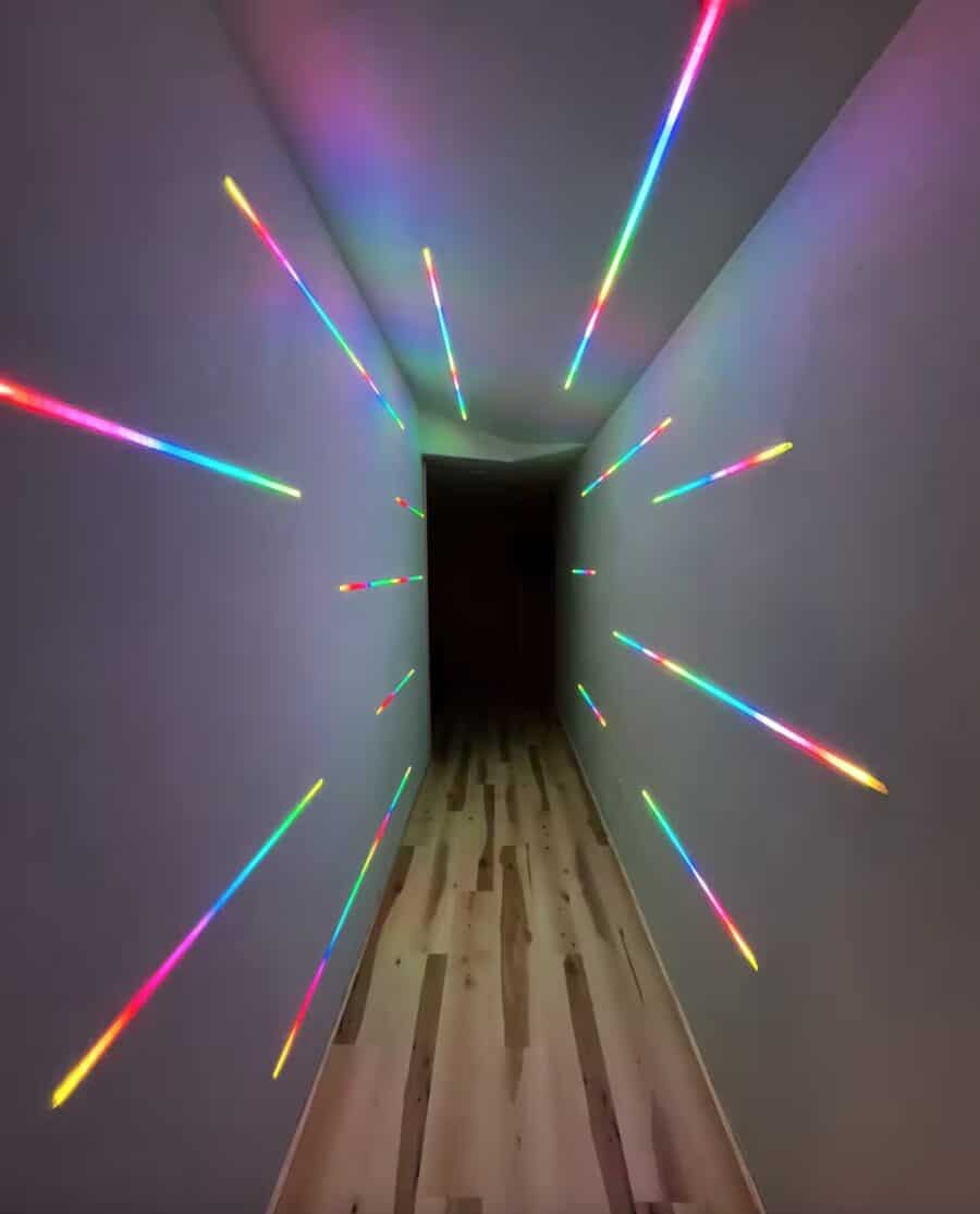 Stargazing cabin hallway with colorful laser lights creating a vibrant atmosphere.
