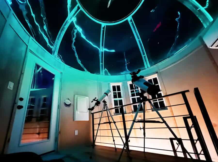 Stargazing cabin with a glass dome roof and telescopes for night sky viewing in Springdale, Arkansas.