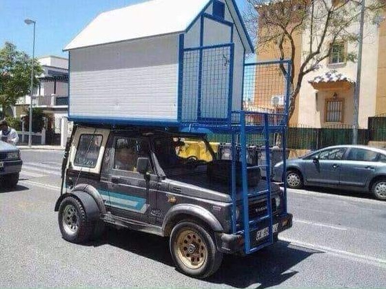 Suzuki Samurai Jeep Spotted with a Rooftop Tiny House or Shed