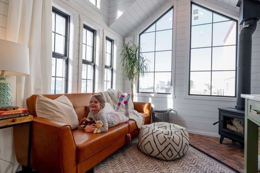 Bank of black-framed windows and clerestory glazing above the Daphne's living room seating area