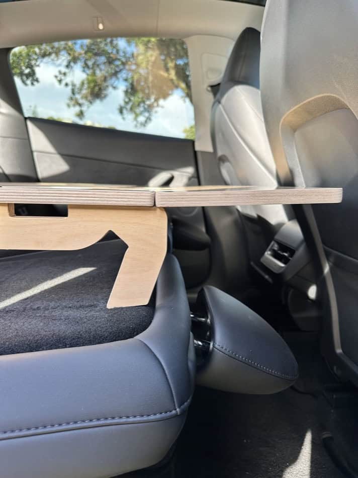 Portable camping platform for Tesla Model Y, S, or X interior. Compact, foldable design for small sp.