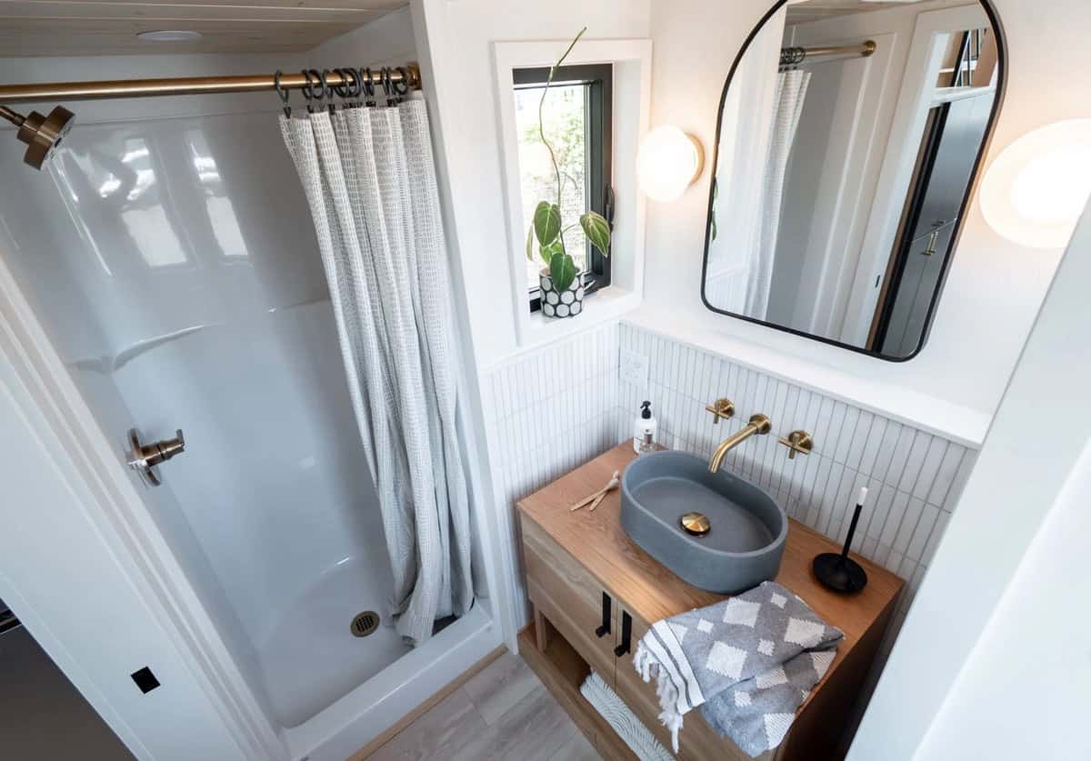 Overhead view of the Terra Urban bathroom showing the shower, vessel sink and brass fixtures