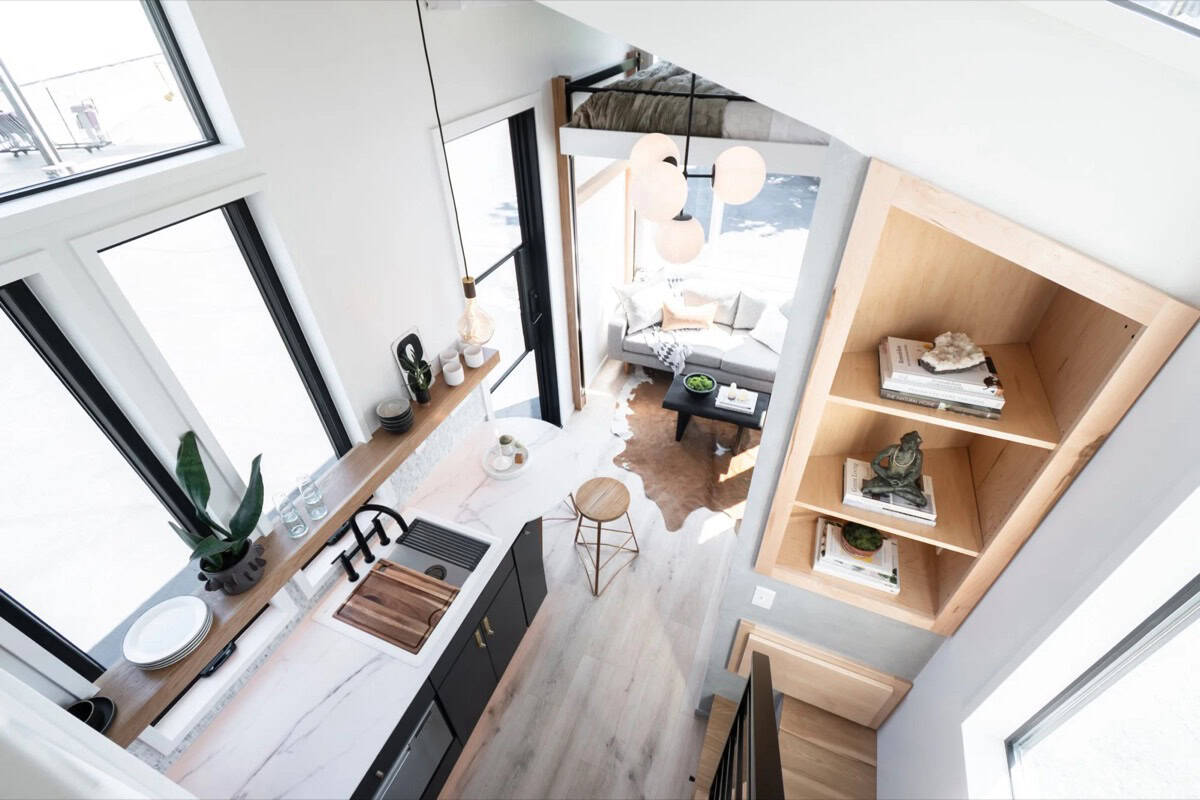 Overhead view from the loft looking down on the kitchen, living room and shelving in the Terra Urban