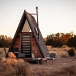 Charming tiny A-frame cabin situated in desert landscape near the Grand Canyon. Perfect for small sp.