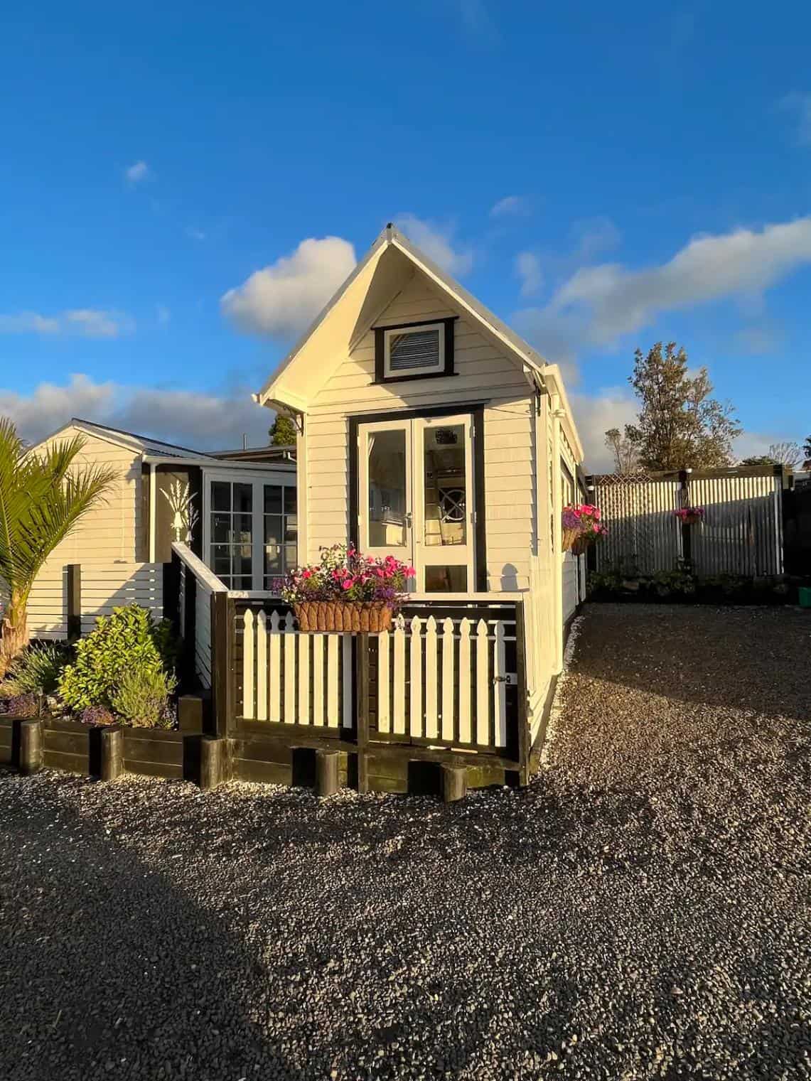 Tiny House with White Siding and Gable Roof