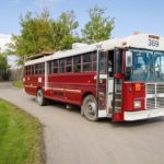 The Doghouse Red School Bus Conversion by Paved to Pines 001