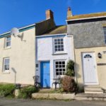 The Doll’s House Cornish Seaside Tiny Home Tucked Between Big Buildings