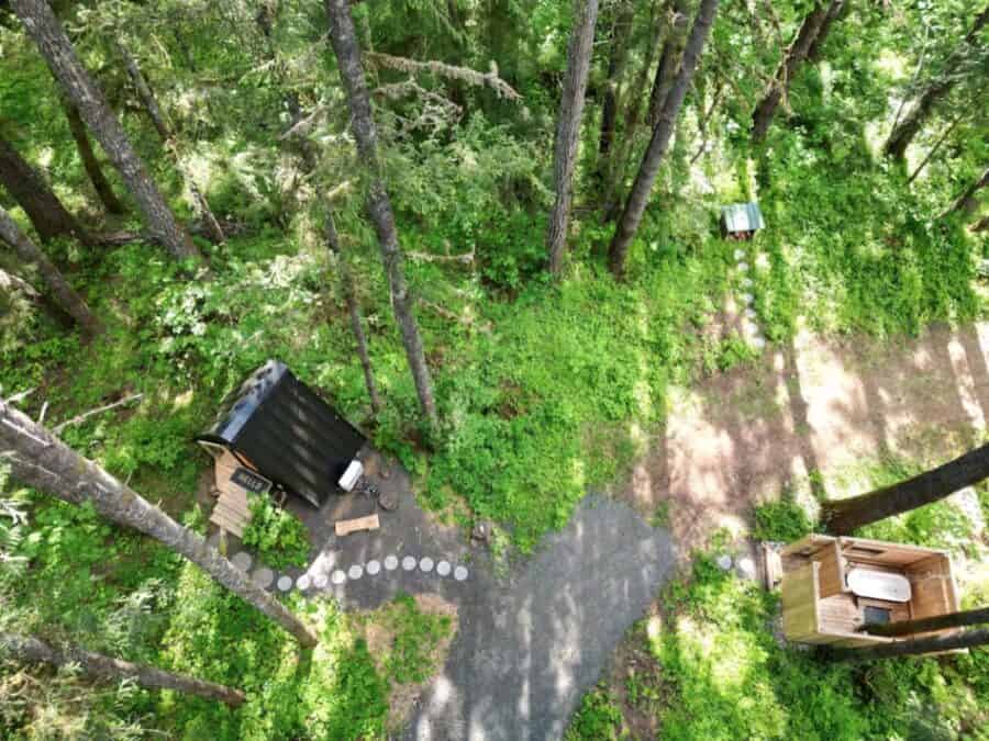 A-frame tiny house nestled among trees in McKenzie Bridge, Oregon.