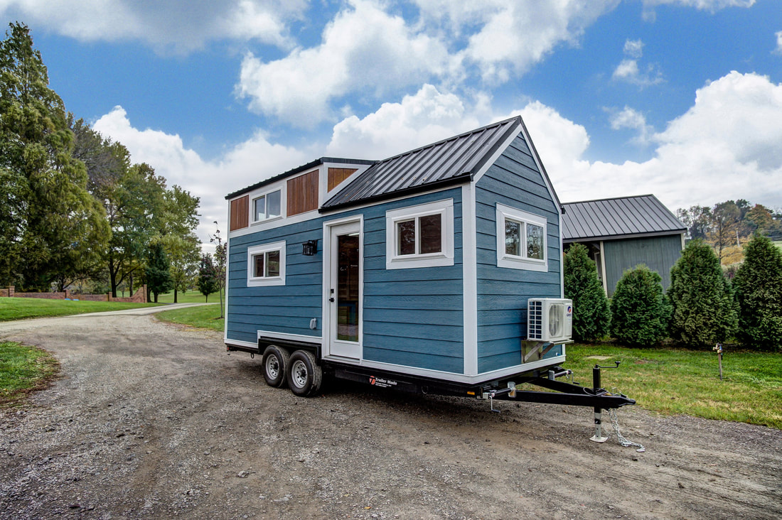 The Baby Blue Hatteras Tiny House by Modern Tiny Living