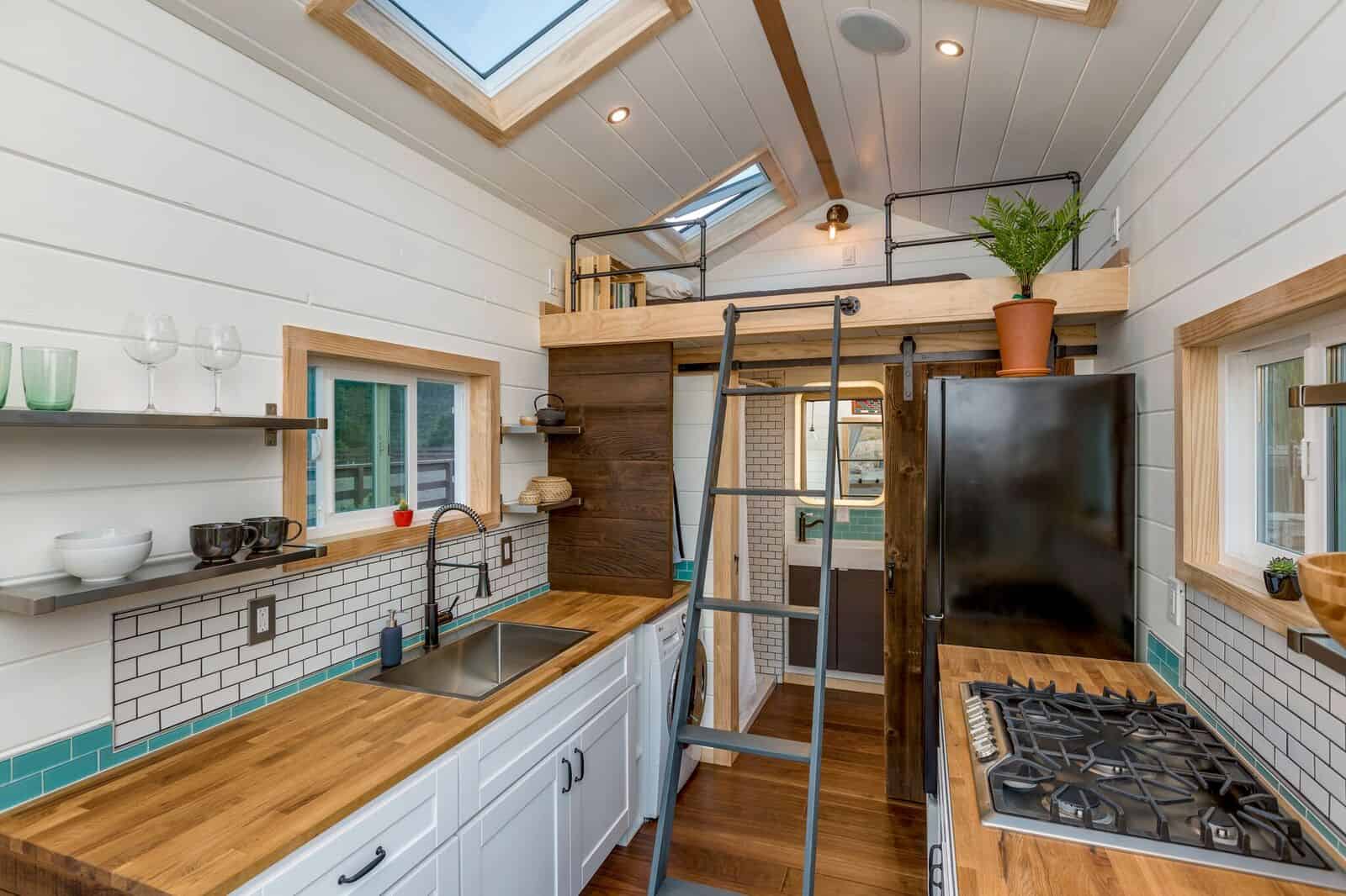 A removable ladder leading up to the sleeping loft above the bathroom in the Joshua Tree tiny house