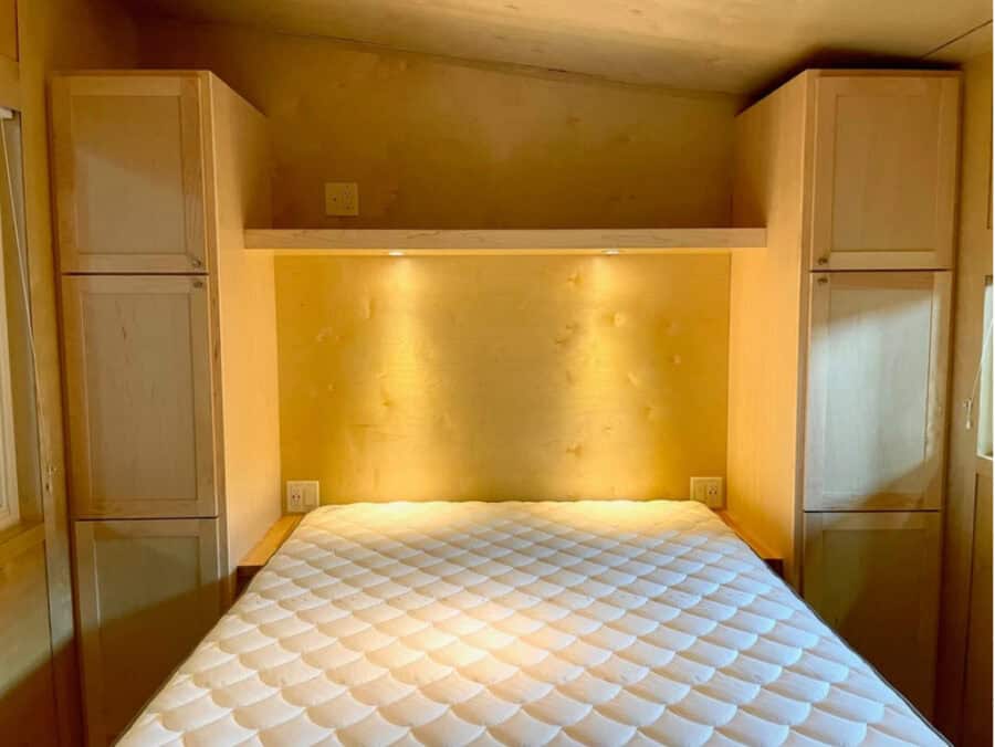 Bright tiny house bedroom with extra-wide first-floor design in The Oaks Tampa Bay.