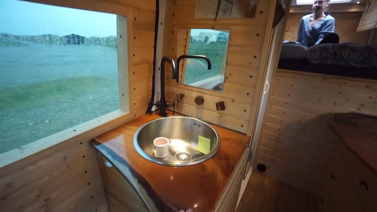 Explore a Stunning Custom Van Conversion with Sliding Bed