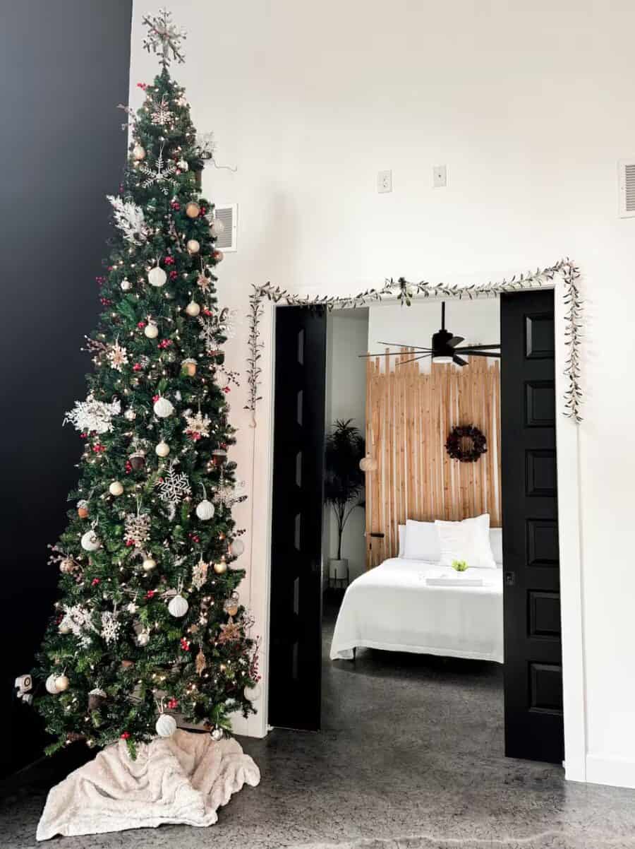 Cozy pine cabin with Christmas tree and modern decor in Pace, Florida.