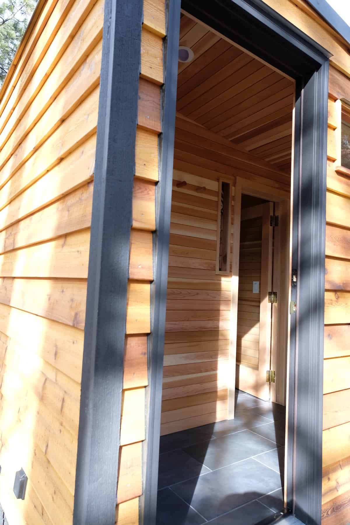 The Silverado sauna entry showing the changing room and glass door into the cedar hot room