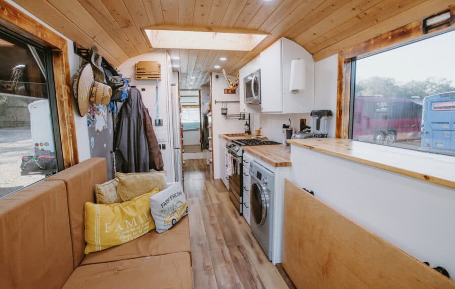 Cozy tiny house interior featuring a kids bunk room and compact kitchen setup.