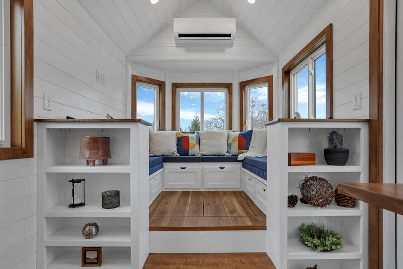 Tink king-size sleeping loft with privacy wall and natural light from end windows
