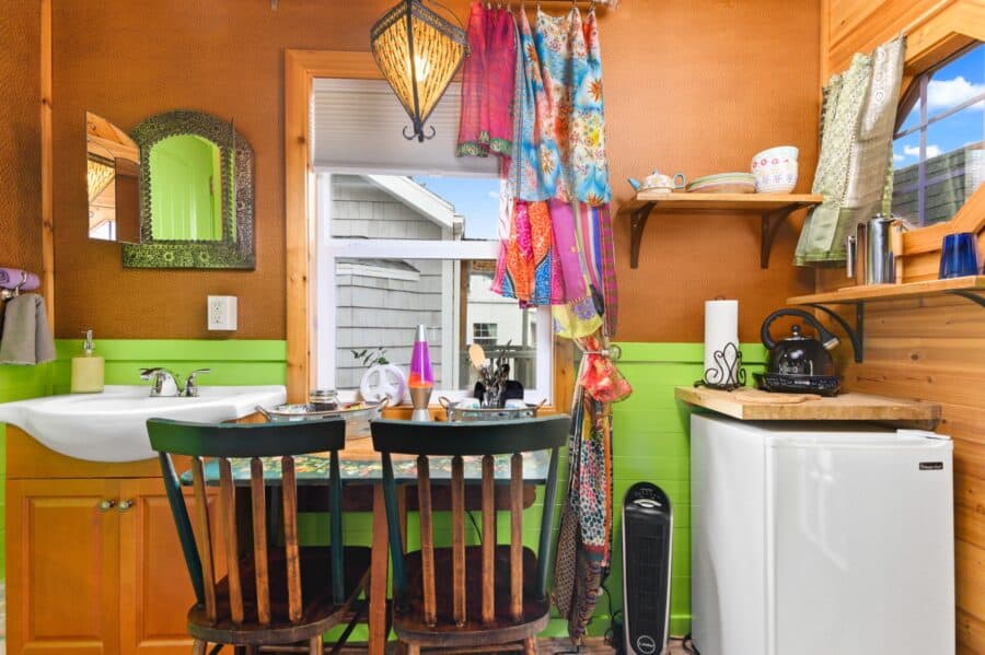 Kitchenette, sink, and Moroccan pendant light in the Boho Wagon tiny house