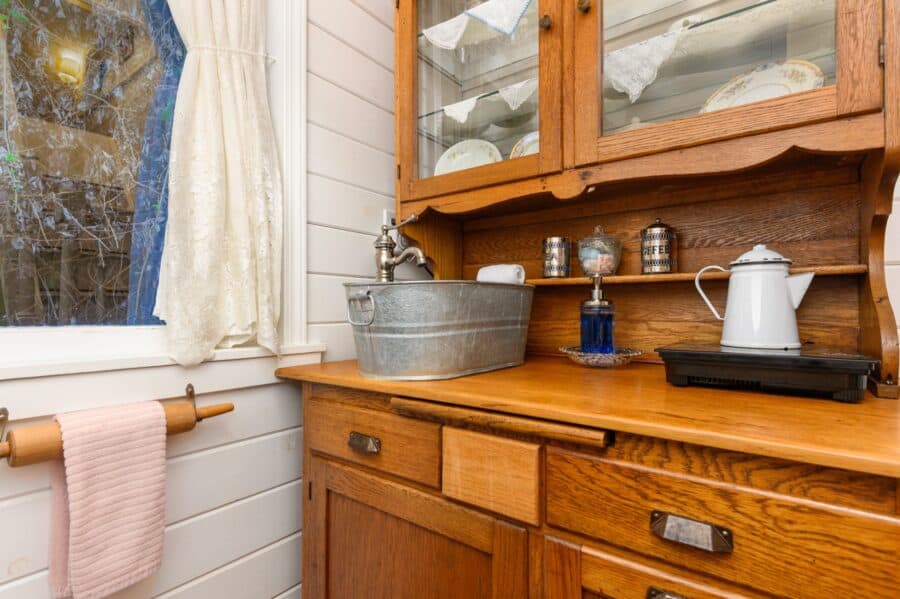 Galvanized basin sink and enamel kettle on the antique hutch kitchen at Tiny Digs