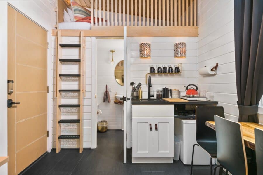 Finlandia tiny house kitchenette with ladder to the second loft at Tiny Digs Portland