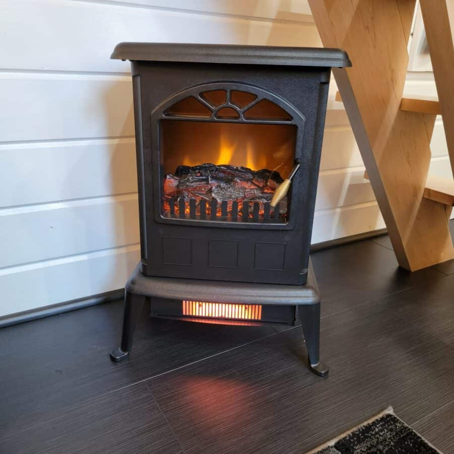 Electric stove heater in the Finlandia tiny house at Tiny Digs