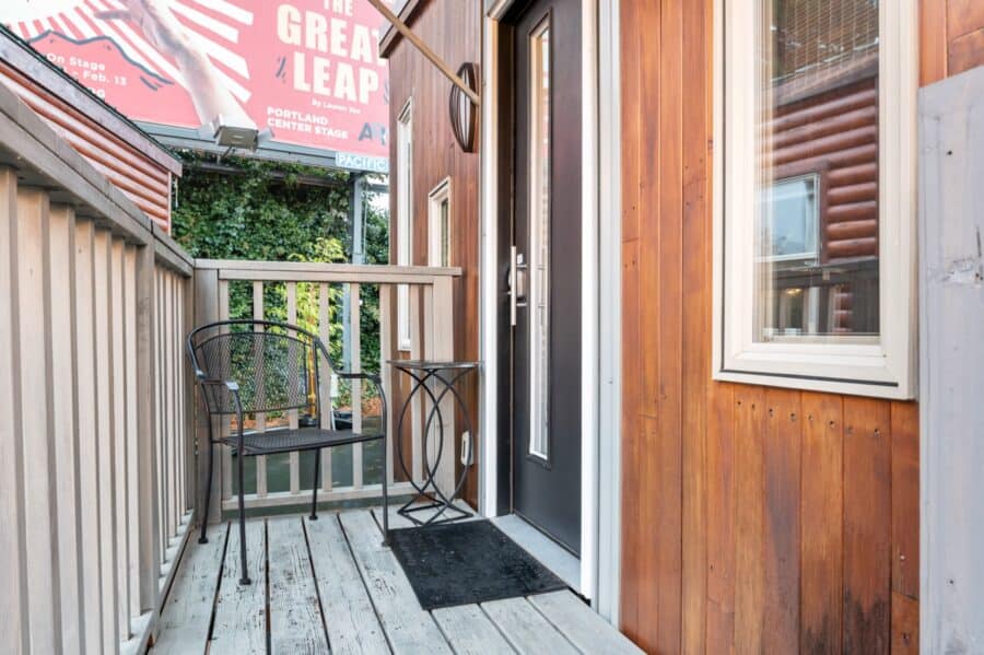 Front deck and entry door of the Modern tiny house at Tiny Digs