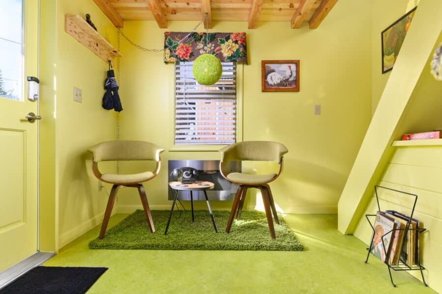 Mid-century chairs and record rack in the living room of the Rock n Roll tiny house