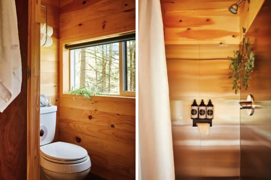 Compact tiny house bathroom with wood interior and natural light.