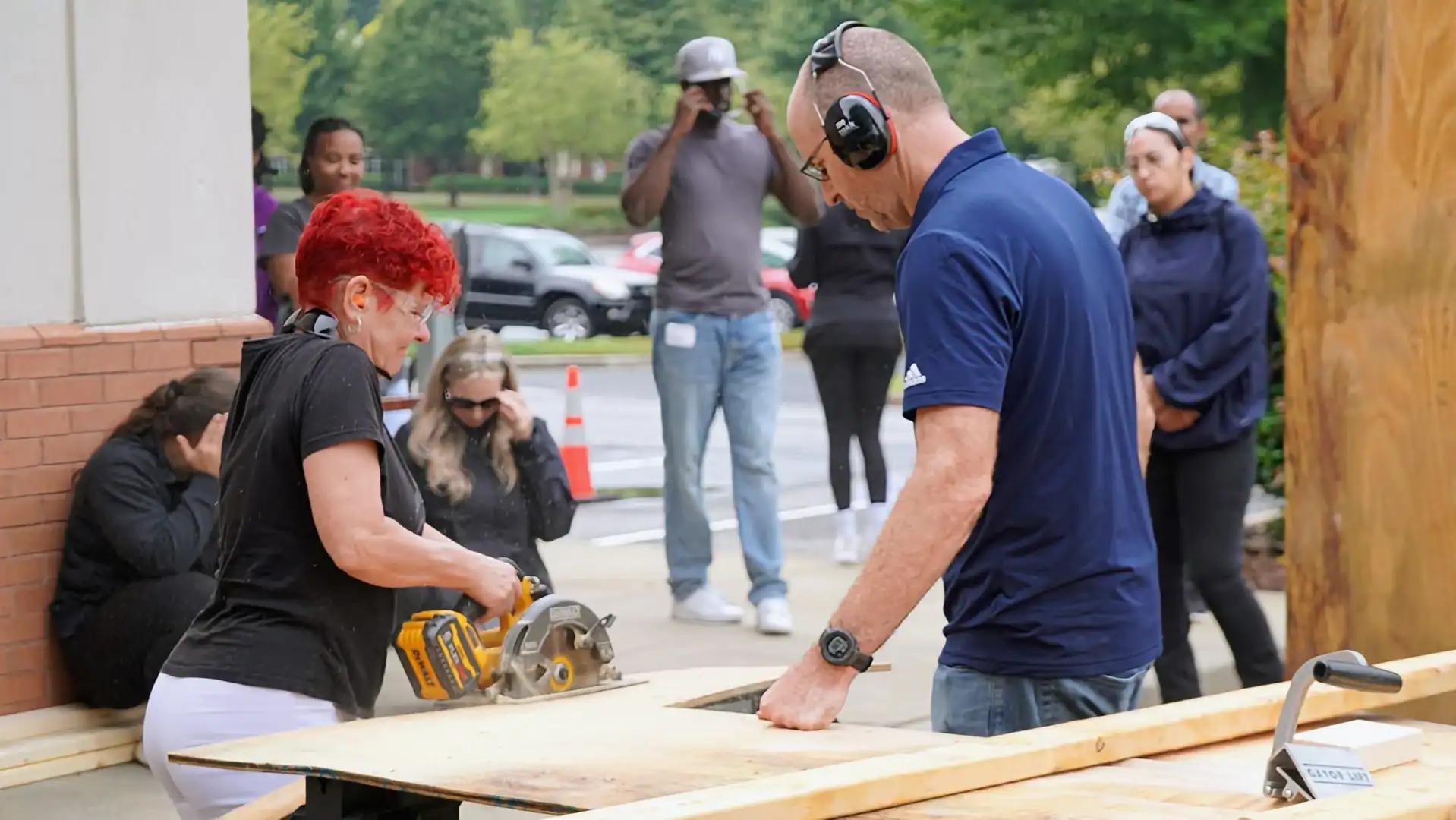 Workshop attendee learning hands-on tiny house framing techniques