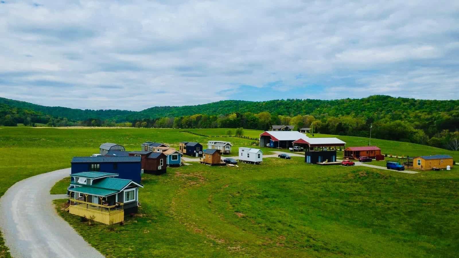 Ground-level view of tiny homes lined up at Tiny Homes Village in Rock Island, Tennessee