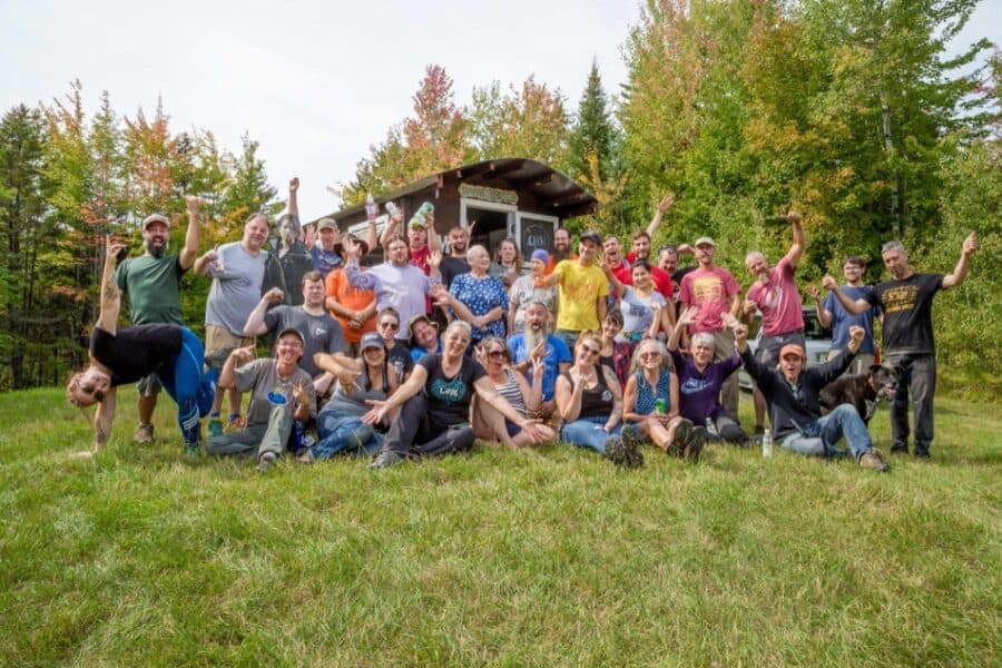 Group of people at Tiny House Summer Camp in Vermont, celebrating small space living.