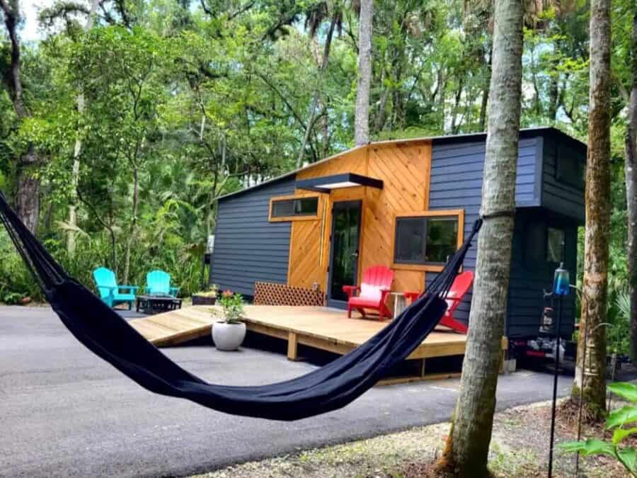 Charming tiny house with modern design nestled among trees in Thonotosassa, Florida. Perfect for a p.