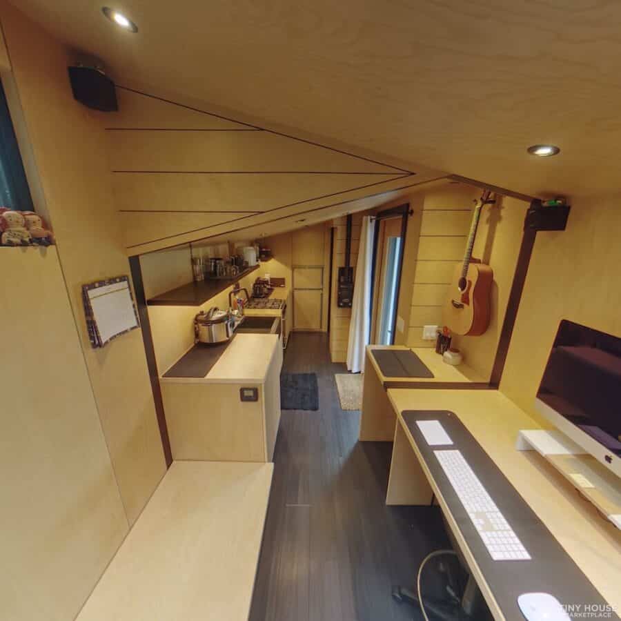 Black & Birch Tiny Writer's Cabin interior with compact kitchen and workspace.