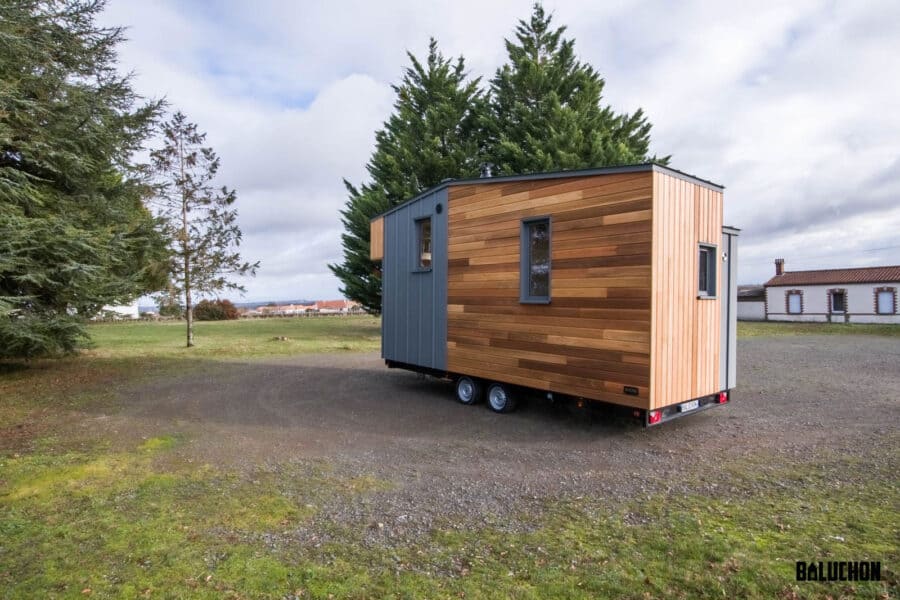 Flexible tiny house with a modern design and versatile loft space for living or working.