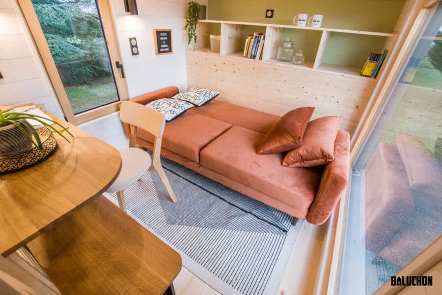 Flexible small space with cozy sofa and creative loft design.