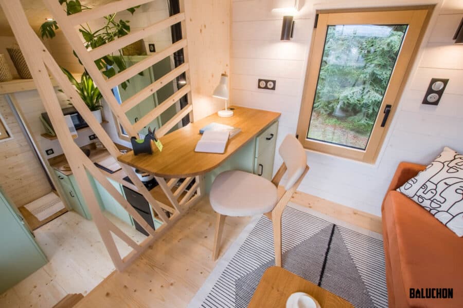 Flexible space in tiny house with loft for work or relaxation.