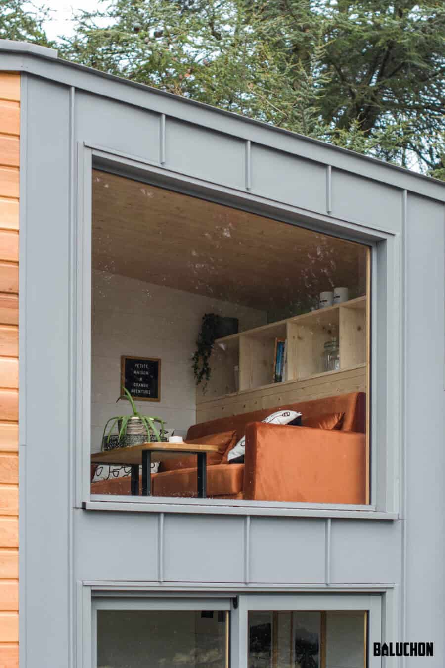 Cozy tiny house interior with a flexible loft space and stylish furniture.
