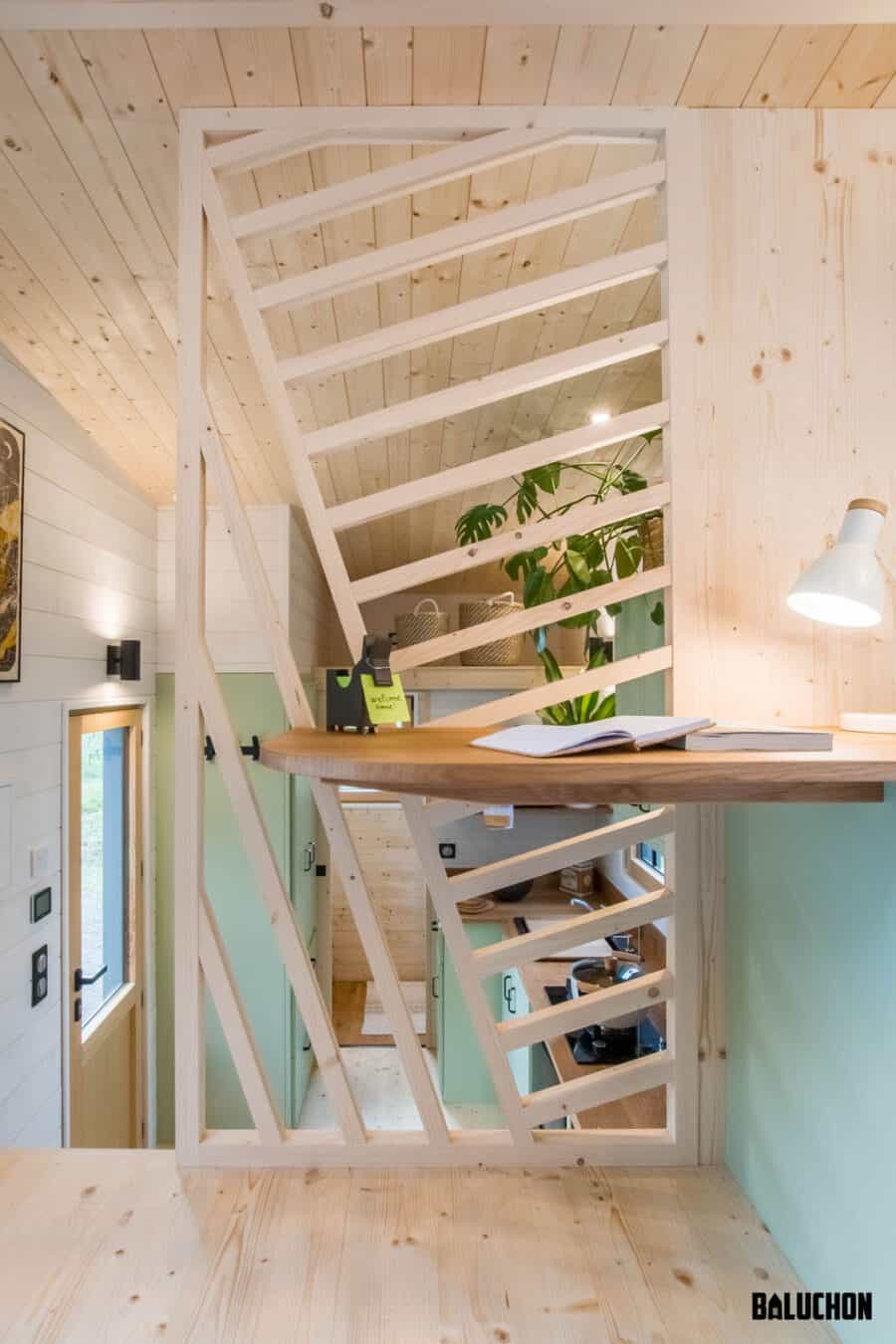 Creative flex room loft in tiny house with innovative staircase design.