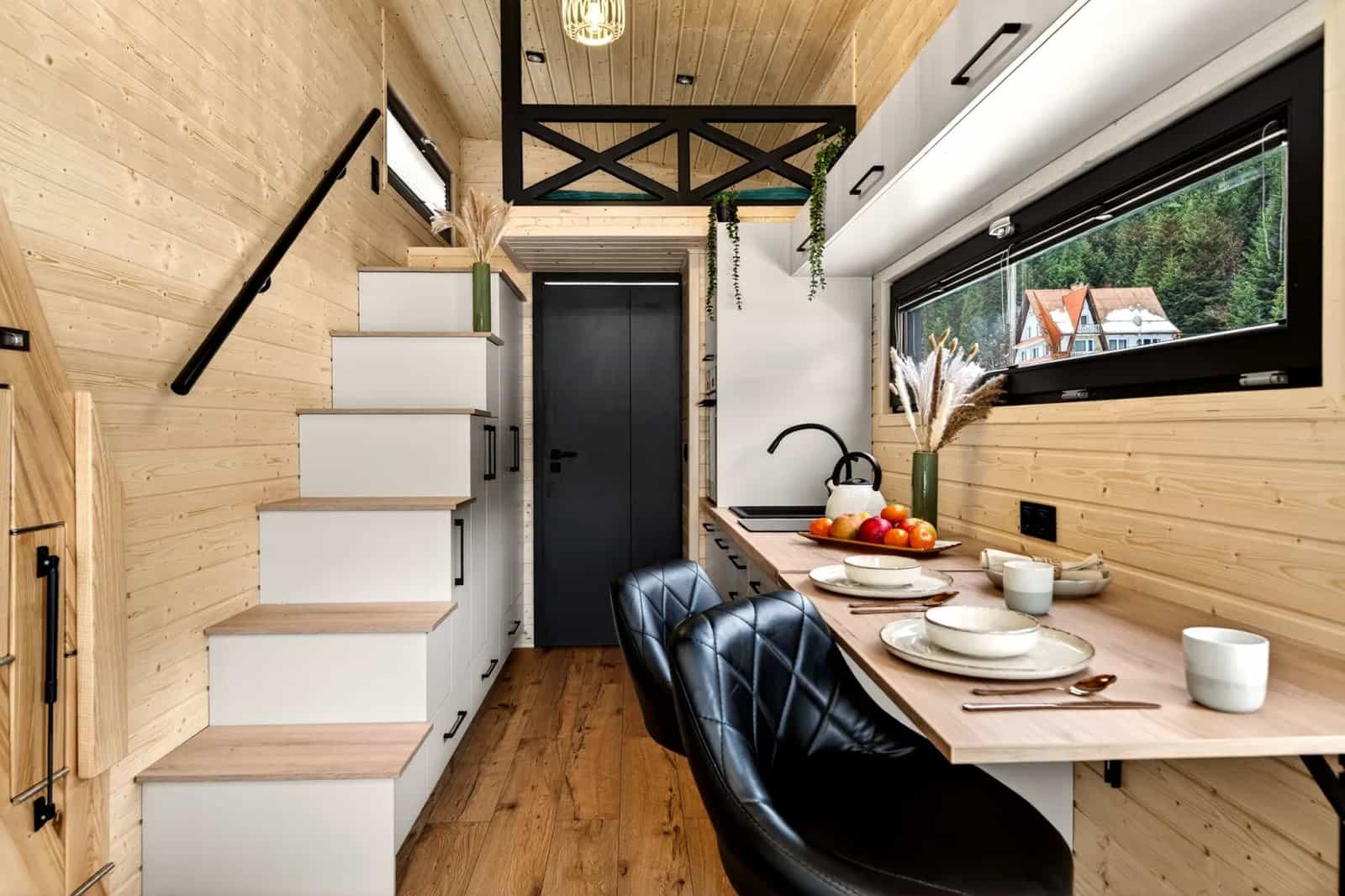 Dining bar and the staircase up to the mezzanine in the Tommy tiny house