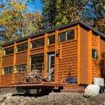 Modern tiny house with lake view and outdoor deck at Canoe Bay.