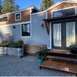 Pre-owned 28-foot tiny house with modern design and small space living features. Perfect for minimal.