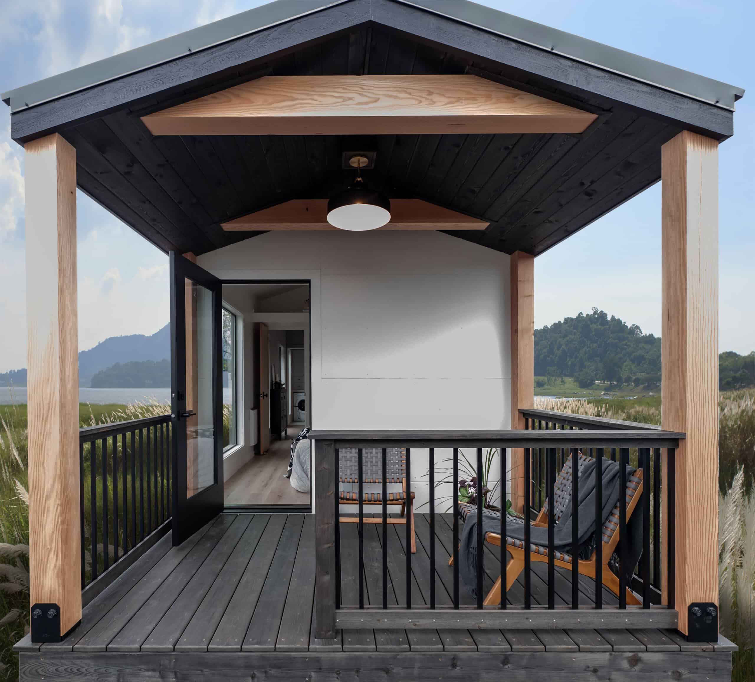 Covered deck with cedar posts, black railing, and ceiling light on the Urban Gable Park