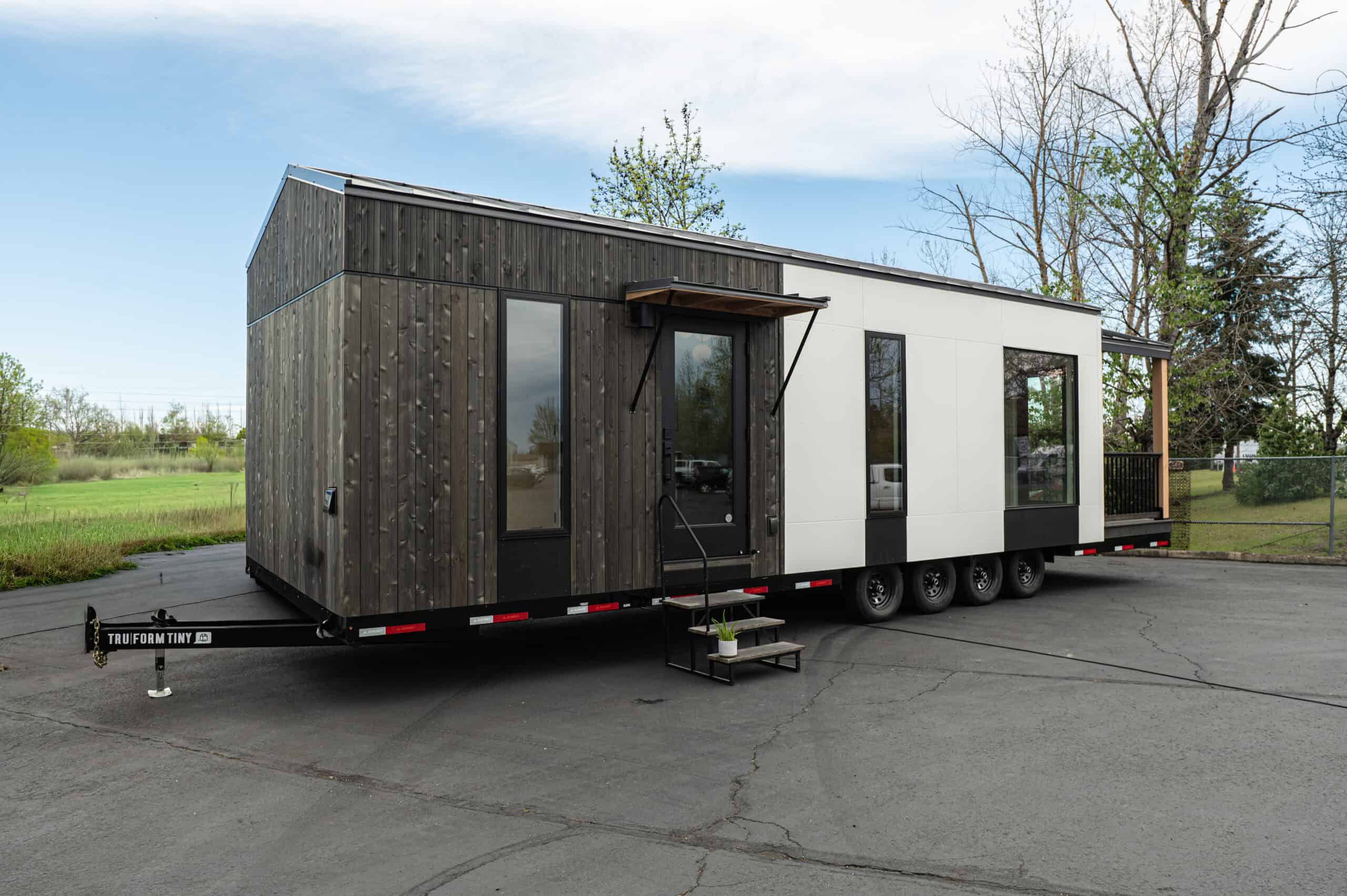 Side view of the Urban Gable Park showing cedar and black exterior with large windows