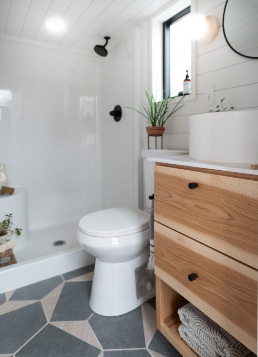 Bathroom in a tiny house with modern fixtures and minimalist design.